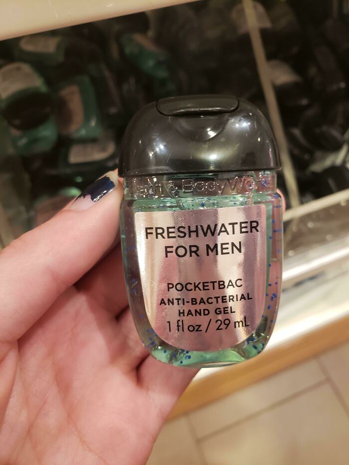 Hand holding a gendered antibacterial hand gel labeled Freshwater for men, highlighting gendered nonsense products.