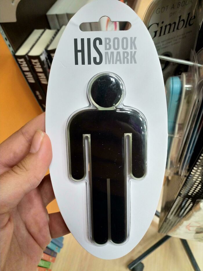 Hand holding a black male figure bookmark labeled His Book Mark, highlighting gendered nonsense product design.