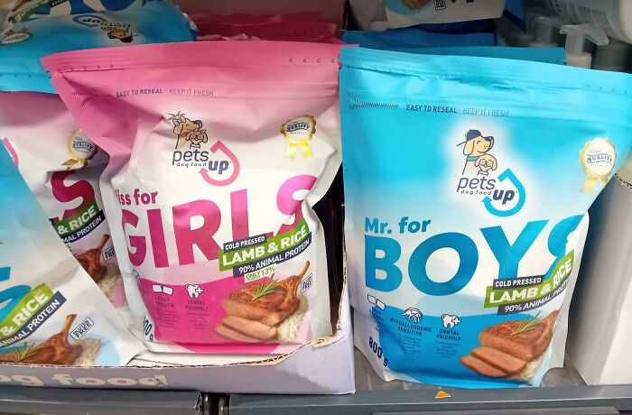 Pink and blue pet food bags labeled for girls and boys, highlighting examples of gendered nonsense in marketing.