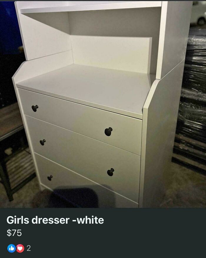 White dresser with three drawers and black knobs, highlighting examples of gendered nonsense in product labeling.