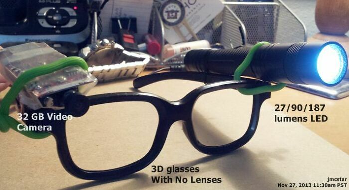 DIY fail showing black 3D glasses with no lenses rigged with a 32 GB video camera and a 27/90/187 lumens LED light.