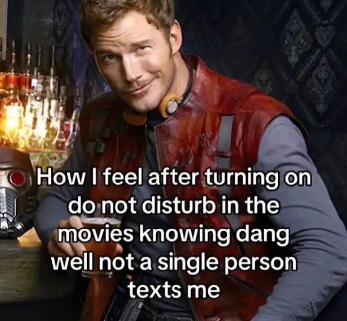 Character smirking in a red jacket with relatable meme text about turning on do not disturb and no one texting.