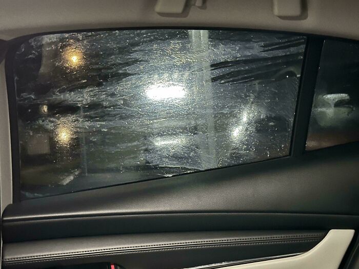 Car window covered in thick dirt, illustrating an example of careless behavior from dumb drivers.