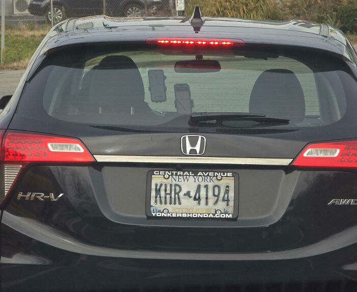 Black Honda HR-V with New York license plate stopped on the road, illustrating dumb drivers behavior in traffic.