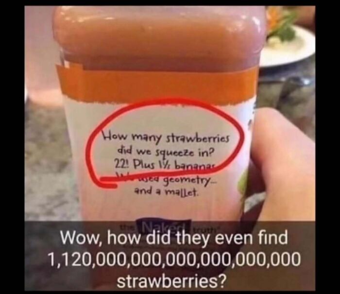 Close-up of a juice bottle label with a humorous meme explaining the number of strawberries squeezed in the drink.