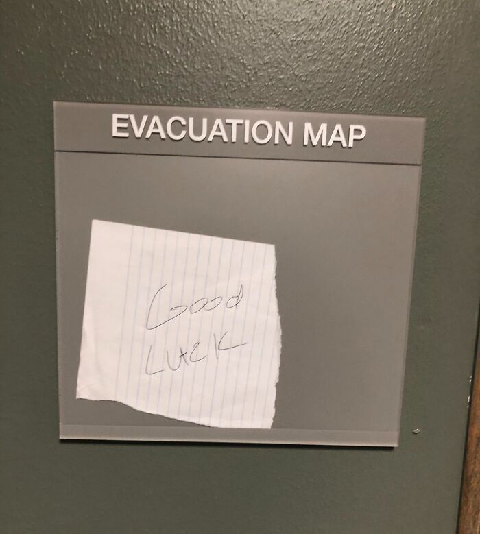 Evacuation map covered by a handwritten note saying good luck, illustrating reckless work moments in safety.