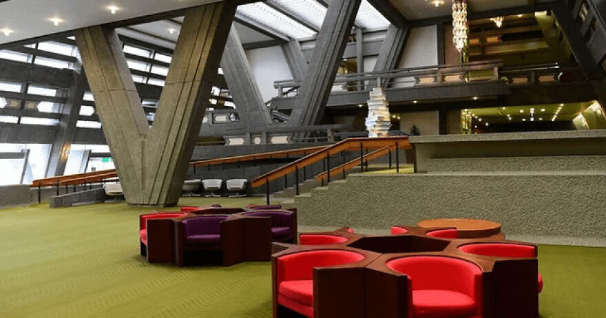 Modern interior space showcasing unique structural elements and seating, highlighting examples of Japanese architecture design.