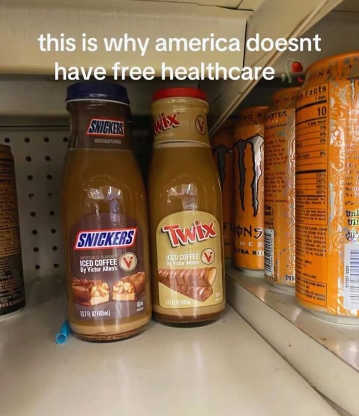 Funny screenshot of Snickers and Twix iced coffee bottles with text about free healthcare on a store shelf.