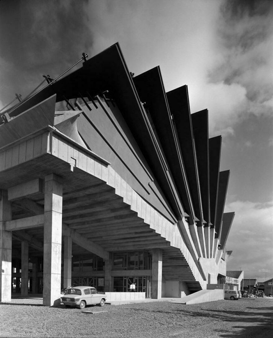 Modern Japanese architecture with bold, angular concrete and steel design elements in a striking structural example.