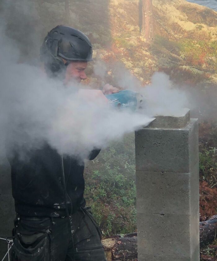 Man using a power saw on concrete block without visible eye protection, illustrating reckless work moments in safety videos.