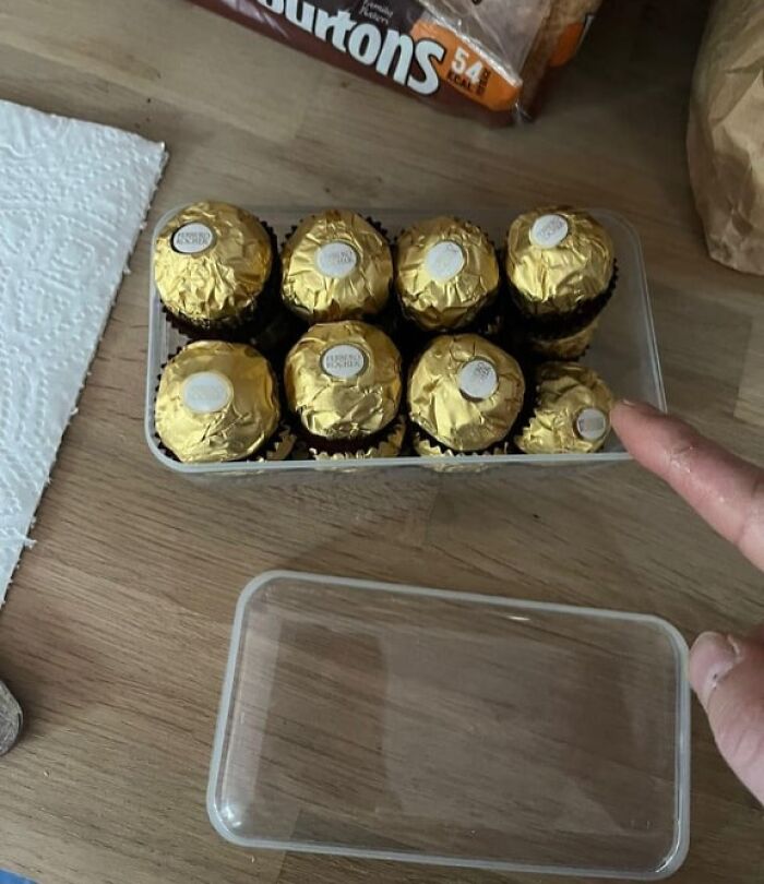 Ferrero Rocher chocolates packed tightly in a box with one missing, illustrating infuriating examples of men being men.