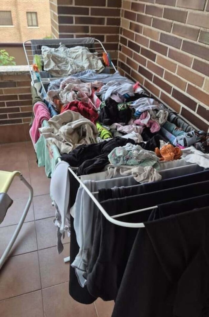 Clothes care drying rack overloaded with mixed laundry, illustrating men being men and infuriating habits shared by women.