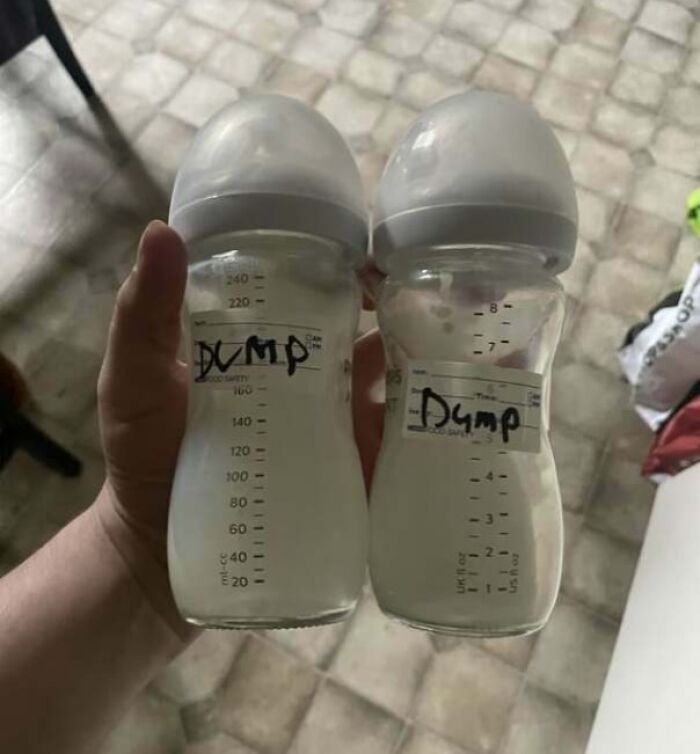 Two baby bottles filled with milk labeled dump, illustrating infuriating examples of men being men shared by women.