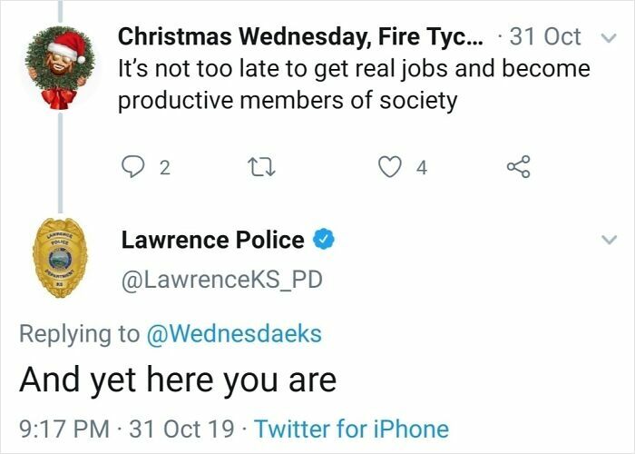 Screenshot of a humorous interaction on a police social media account showing a witty reply from Lawrence Police.