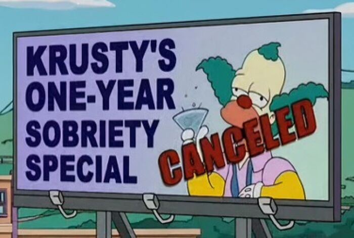 Cartel divertido de Krusty en Los Simpsons mostrando un letrero de sobriedad cancelada, señal oculta en el fondo.