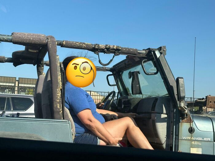 Person driving a Jeep Wrangler with no pants on, illustrating dumb drivers caught in unbelievable situations.