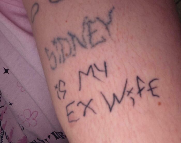 Tattoo on arm with misspelled text showing a poorly done tattoo, illustrating bad tattoos and lack of planning.