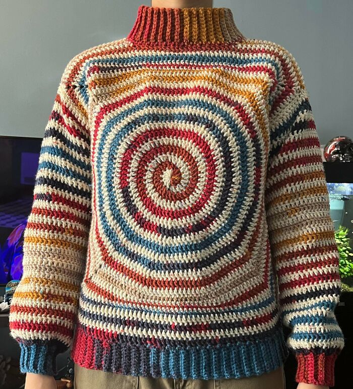 Crocheted awesome multicolored sweater with a vibrant spiral design on the front. This is a truly awesome crocheted piece.