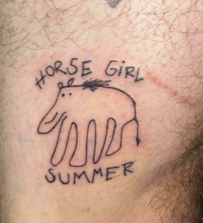 Poorly drawn horse tattoo with misspelled words showing bad tattoos that prove thinking first is optional.