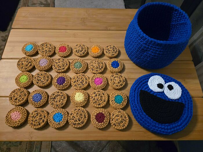 Awesome crocheted Cookie Monster basket with a matching face lid and many colorful crocheted cookies.