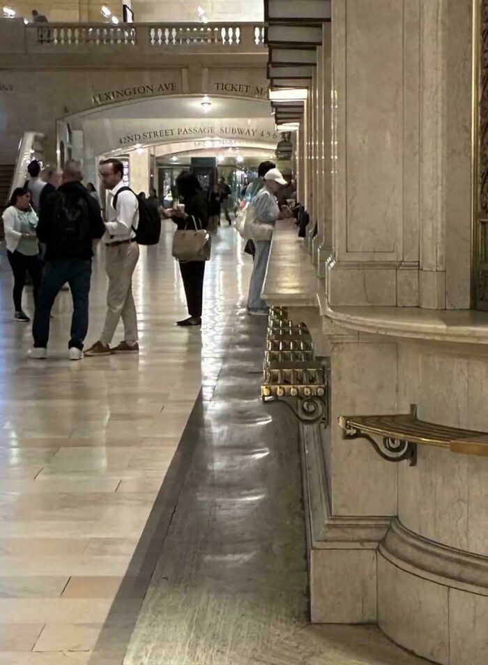 Amazing photo capturing people walking through the Grand Central Terminal, showcasing its impressive architecture.