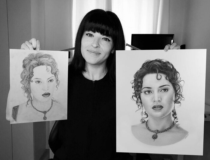 Amazing photos: A woman holding two portraits to brighten your day.