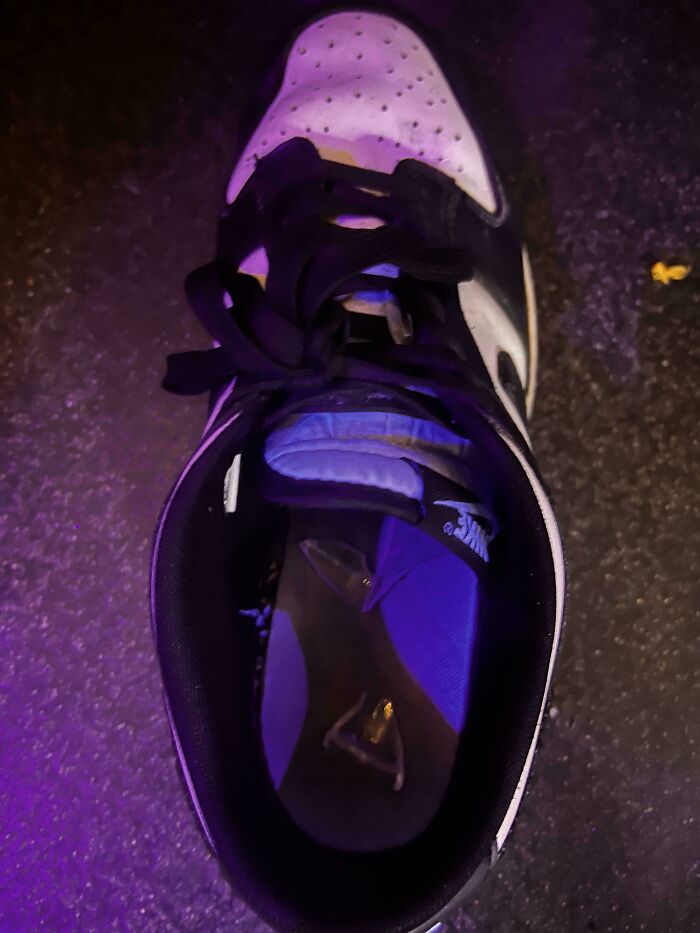 A shoe's interior, dark with a glowing object, possibly creepy, hinting at something unusual related to Hair Of Kids.