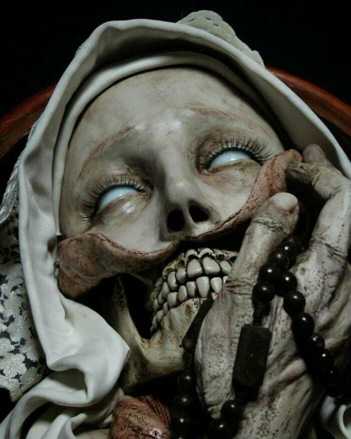 Creepy image of a skeletal nun with glowing eyes, rosary beads in hand. Hair of kids may reveal more unsettling images.