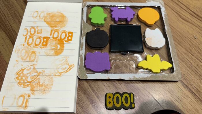 You had one job fail showing poorly stamped Halloween themed ink stamps and uneven imprints on paper.