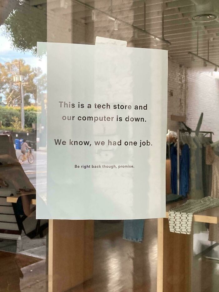 Sign on tech store window apologizing for computer being down highlighting you had one job fails.