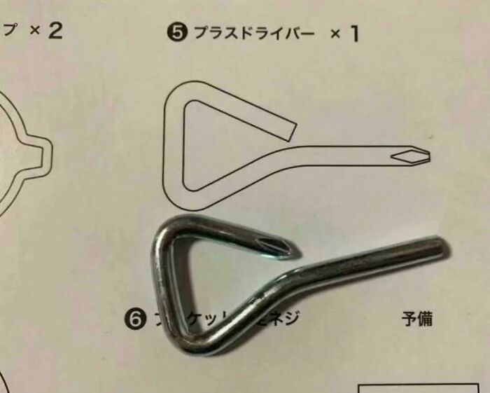 Bent screwdriver metal tool fail placed on instruction manual illustrating proper shape, showing one job fail common sense error.