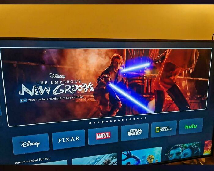 Streaming platform interface showing movie categories with a mismatch between The Emperor’s New Groove title and Star Wars lightsabers scene.
