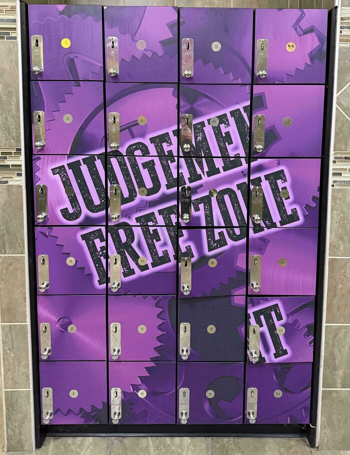 Locker doors painted to spell judgment free zone incorrectly, showcasing a hilarious you had one job fail.