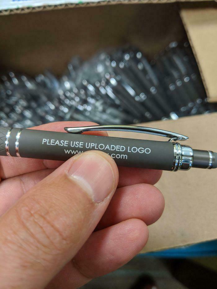 Pen with a printing fail showing placeholder text asking to use uploaded logo, highlighting a common sense fail.