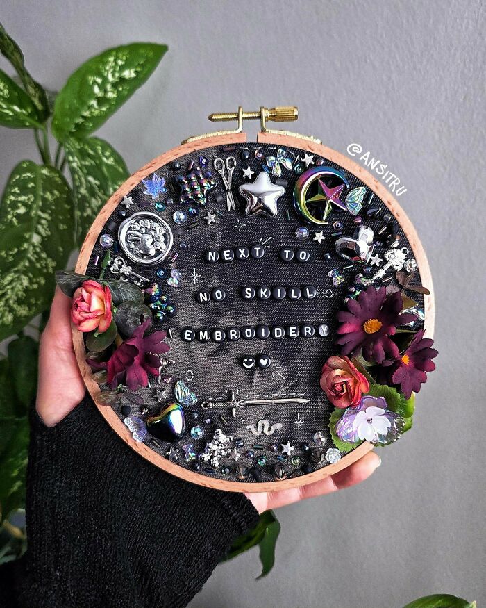Stunning embroidery creation with beads and text in a hoop, inspiring embroidery hobbyists.