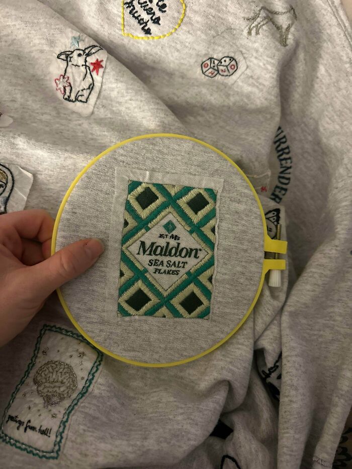 Stunning embroidery creation of a Maldon sea salt packet on a sweatshirt, inspiring embroidery hobbyists.