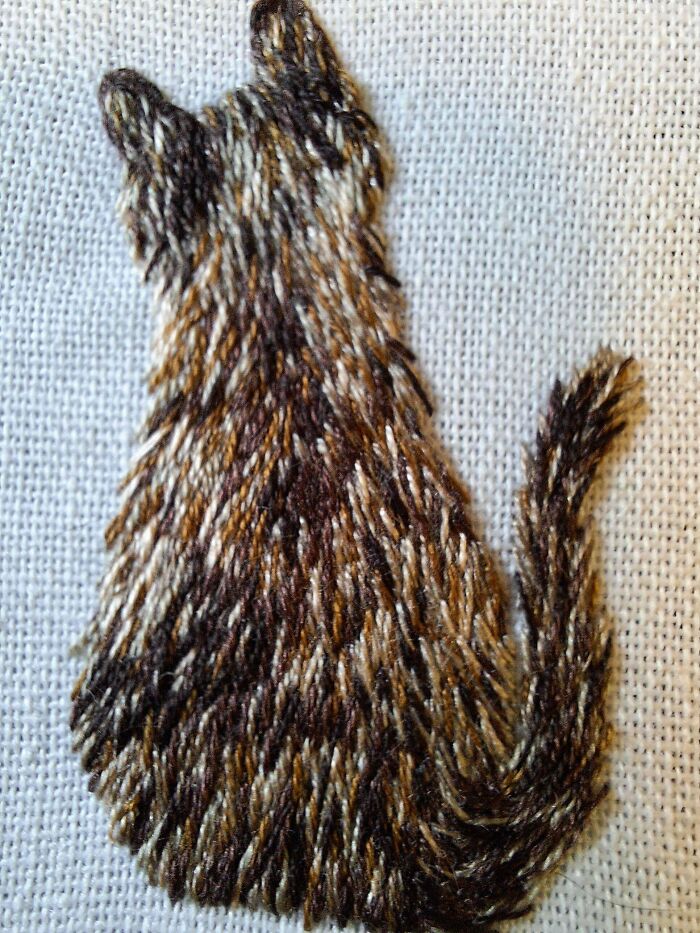 Textured embroidery creations showing the back of a fluffy cat, inspiring creative embroidery hobby projects.