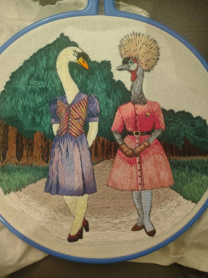 Intricate embroidery creations showing a swan and a crowned crane in elegant outfits, a unique embroidery hobby piece.