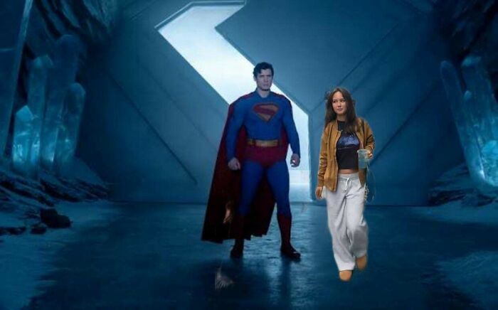 Superman standing in an icy fortress with a casually dressed woman holding a drink, showcasing absurd movie and TV details.