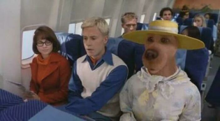 Characters from a comedy movie and TV show scene on an airplane, highlighting hilariously absurd movie details.