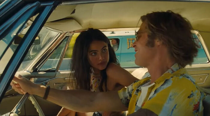 Two people in a vintage car, capturing a moment reflecting hilariously absurd movie and TV details.