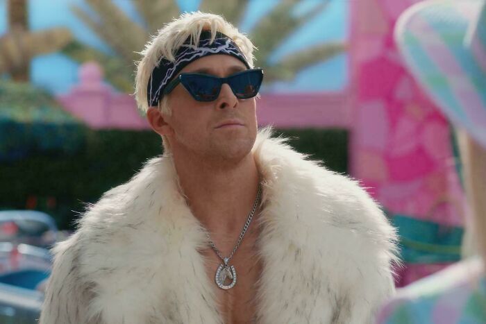Man wearing sunglasses, headband, and fur coat portraying a hilariously absurd movie and TV detail scene.