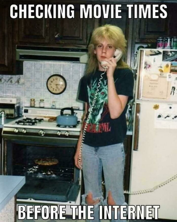Teen with 90s hairstyle using a corded phone in a kitchen, funny meme about checking movie times before the internet.