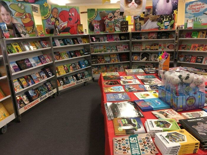 Book fair setup with colorful books and toys displayed, evoking 90s posts and memes nostalgia for childhood memories.