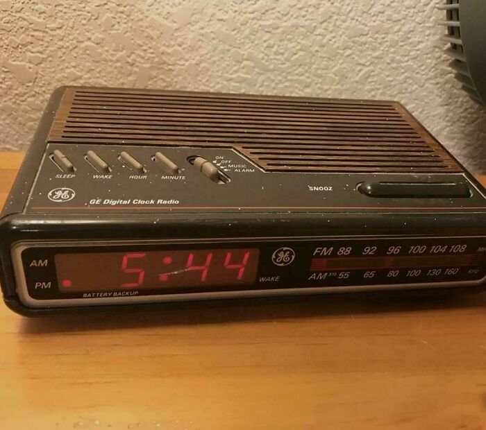 Vintage GE digital clock radio showing 5:44, a nostalgic item from funny 90s posts and memes childhood memories.