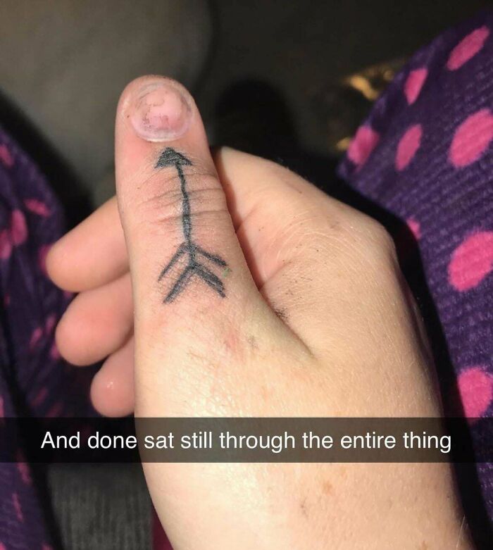 Thumb tattoo of a poorly drawn arrow with uneven lines, showcasing one of many bad tattoos proving thinking first is optional.