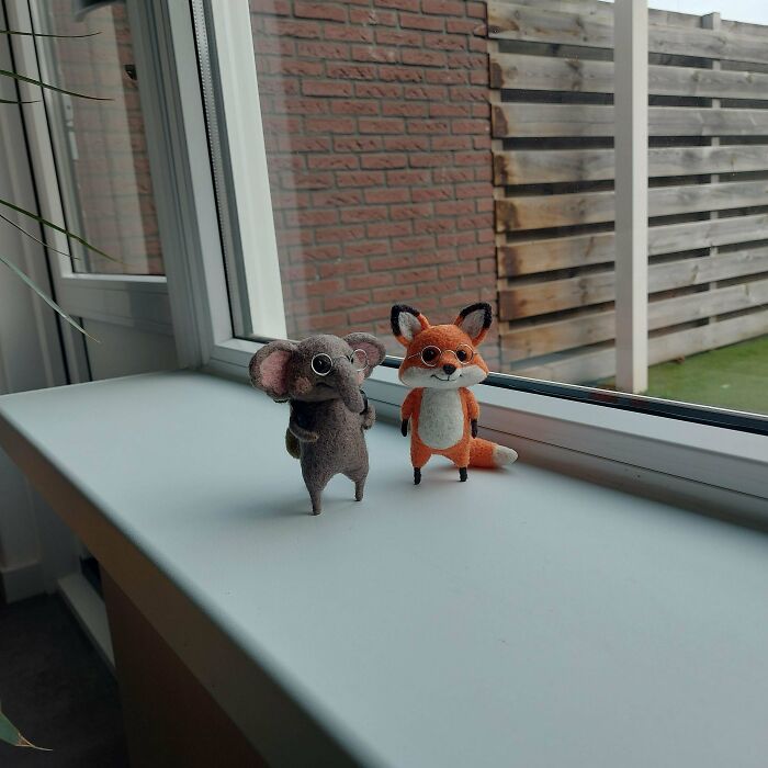 Felted DIY animal figures of an elephant and a fox displayed on a windowsill, showcasing creative DIY wins.
