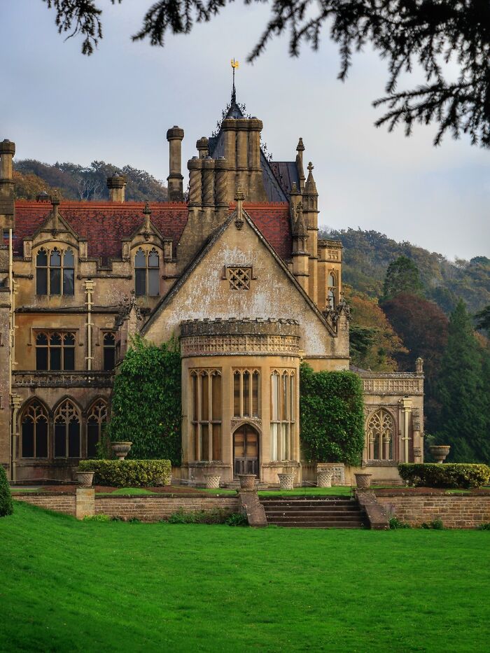 Stately manor house architecture with ivy-covered walls, an example of beautiful historic design.