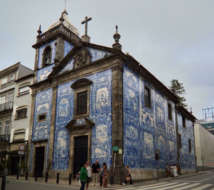 Beautiful architecture: A stunning church facade covered in blue and white azulejo tiles, showcasing unique artistry.