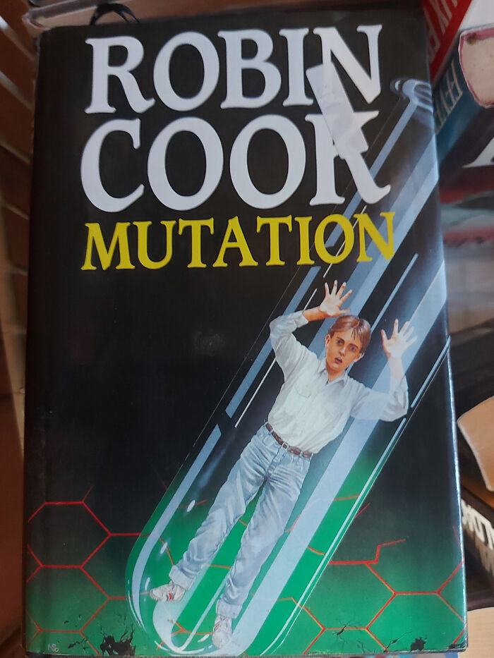 Book cover with a boy trapped inside a test tube, illustrating mutation, representing one of the funny awful book covers.